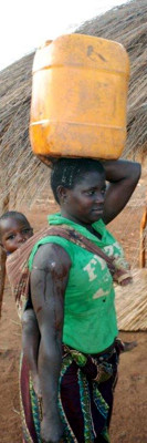 Carrying water, often a woman's job (Mozambique)